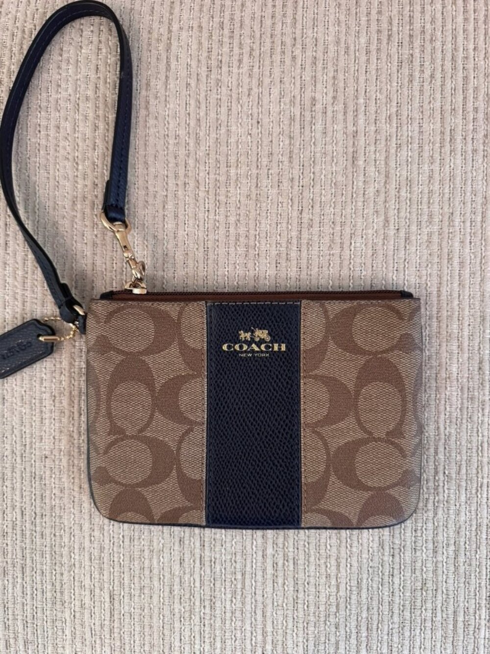 Coach Corner Zip Wristlet In Signature Canvas With Navy Blue Stripe